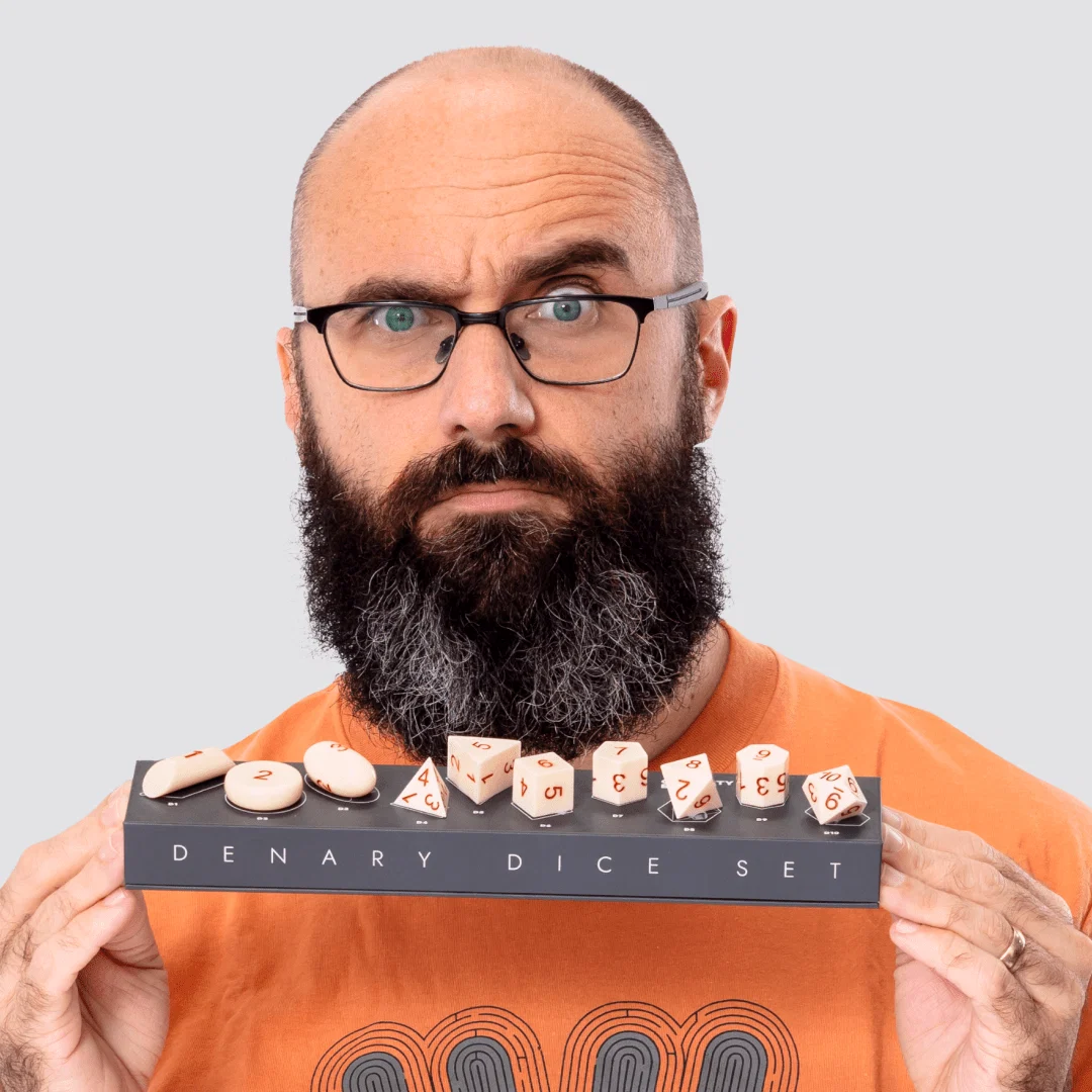 Denary Dice Set displayed on its box